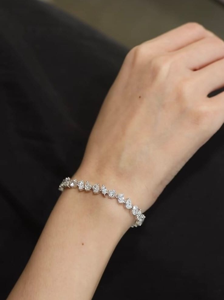 Fancy cut diamond tennis bracelet by Jay Gems worn on wrist
